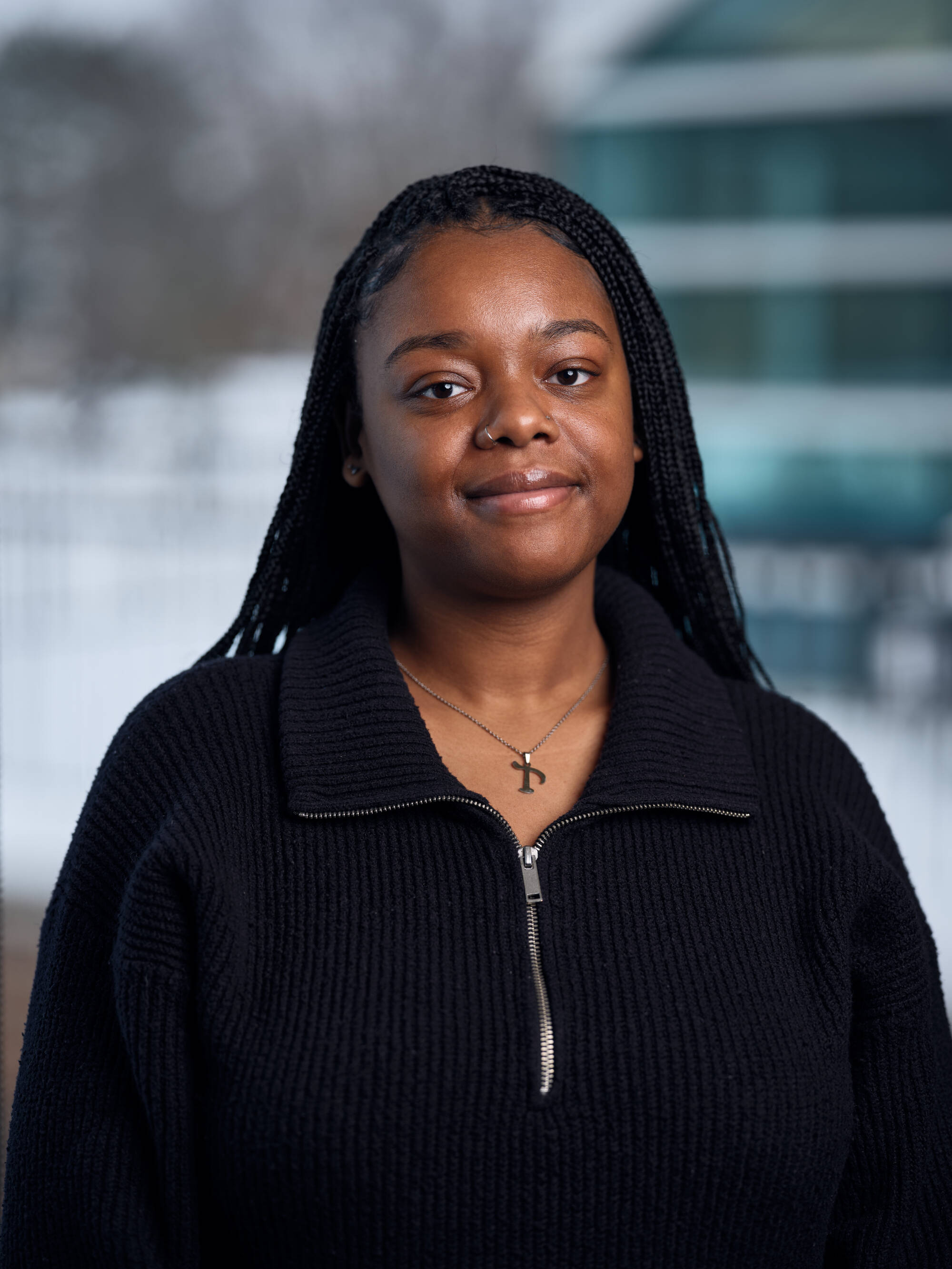 An individual smiling at the camera.